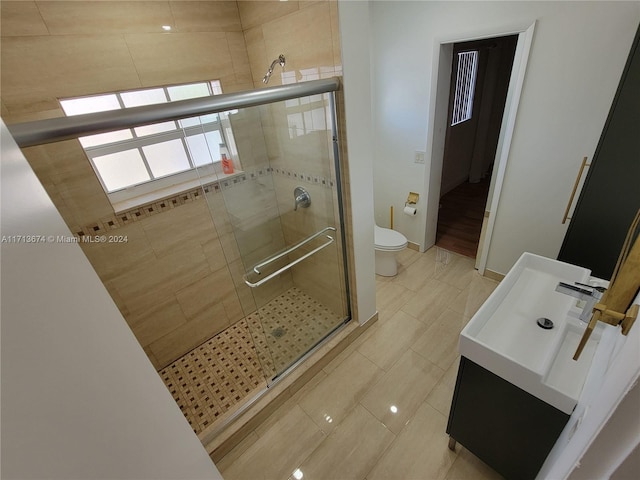 bathroom featuring toilet and walk in shower