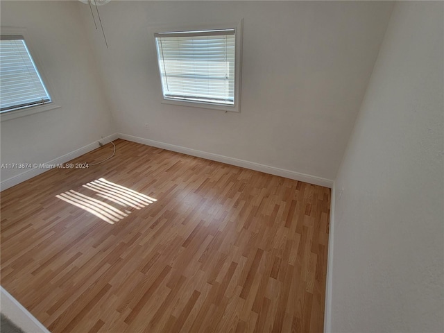 spare room with light hardwood / wood-style floors