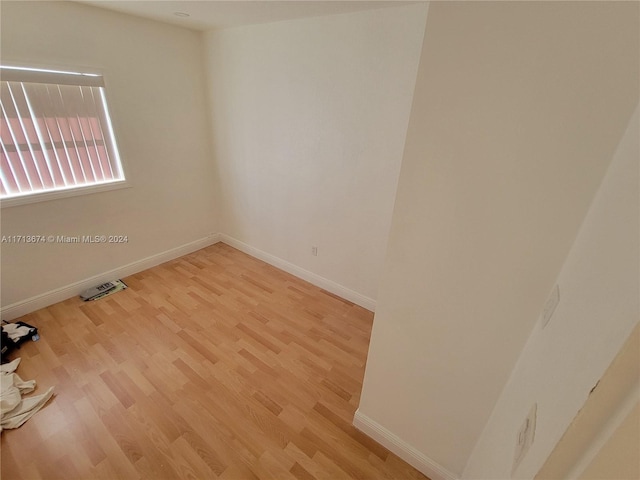 unfurnished room featuring light hardwood / wood-style floors