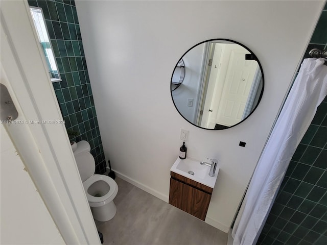 bathroom featuring walk in shower, vanity, and toilet