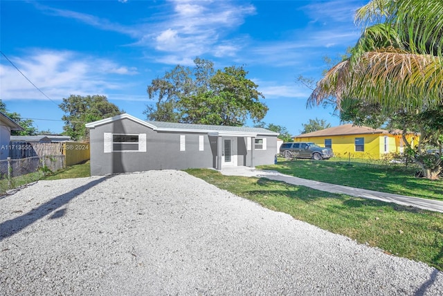 ranch-style home with a front yard