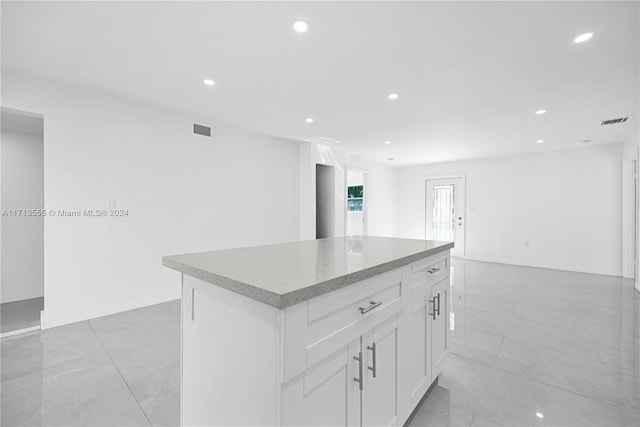 kitchen featuring white cabinetry and a kitchen island