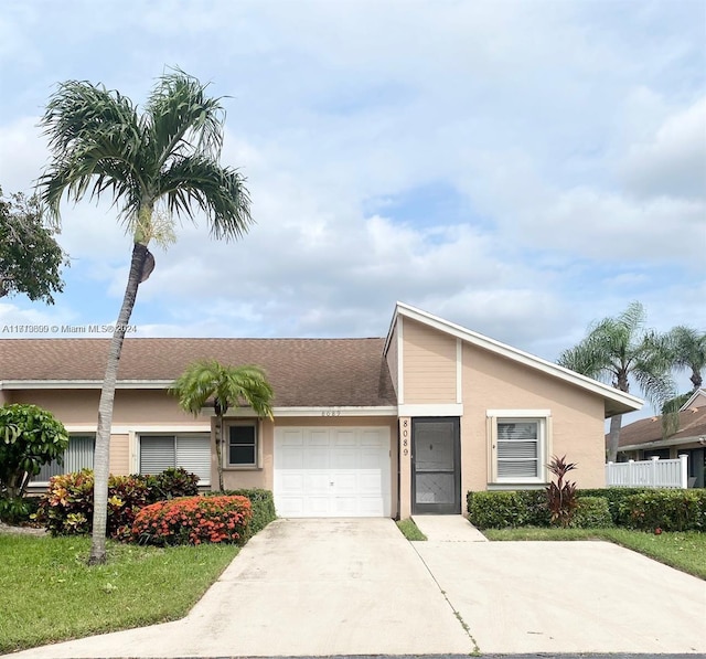 ranch-style home with a garage