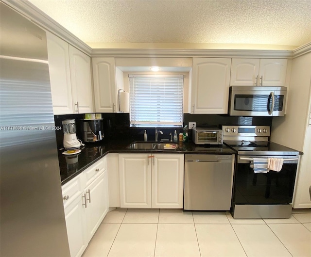 kitchen featuring sink, white cabinetry, and stainless steel appliances