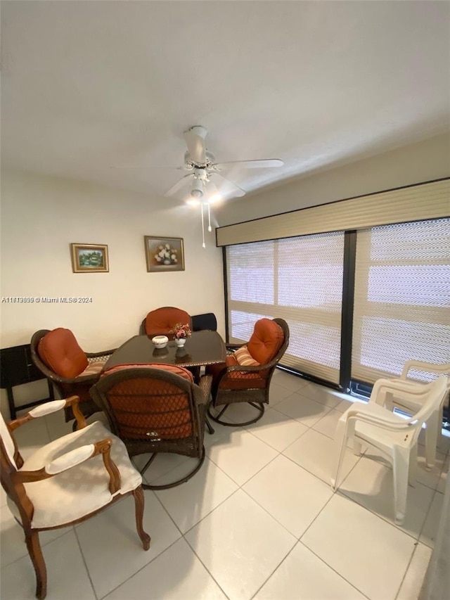 dining room with ceiling fan and light tile patterned flooring