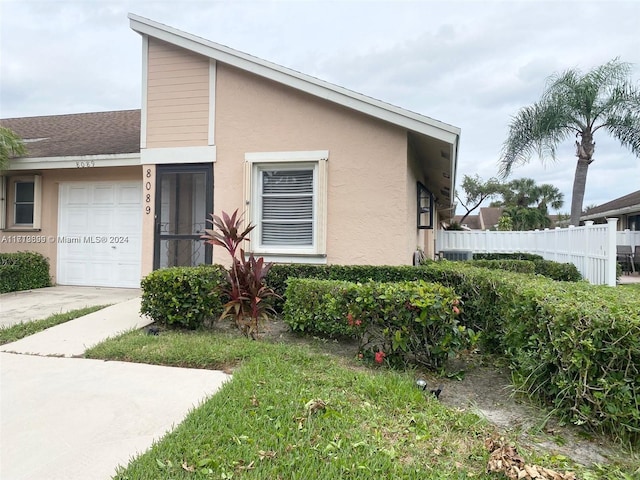 view of property exterior featuring a garage