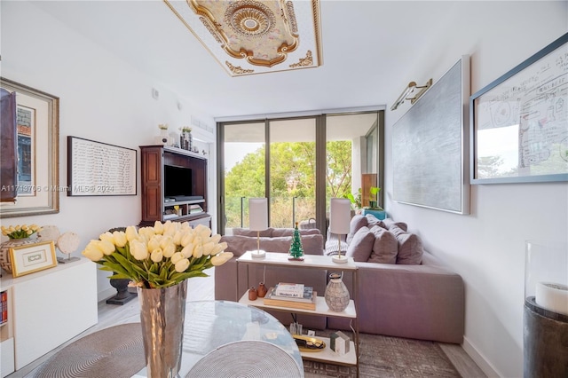 living room with light wood-type flooring and expansive windows