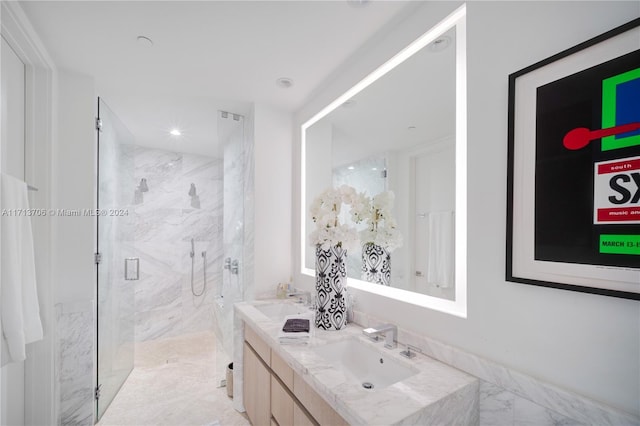 bathroom featuring vanity and an enclosed shower