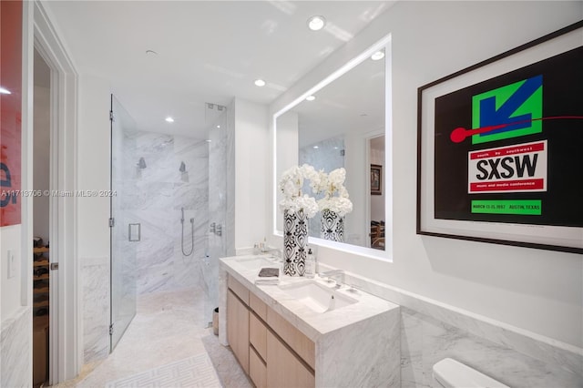 bathroom featuring vanity, toilet, and walk in shower