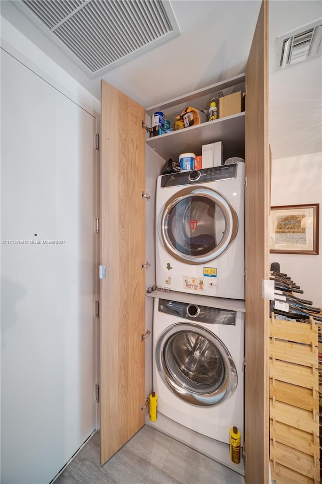 laundry room featuring stacked washing maching and dryer