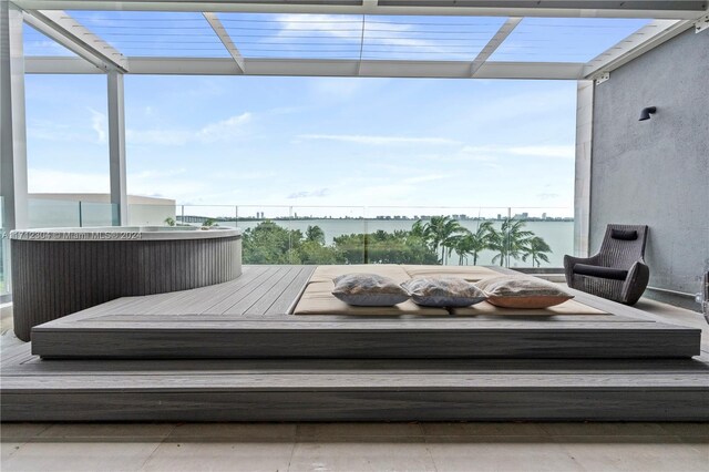 wooden deck featuring a water view