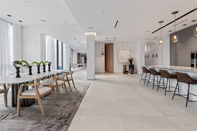 dining area featuring expansive windows