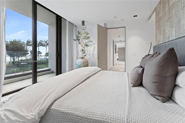 bedroom featuring expansive windows