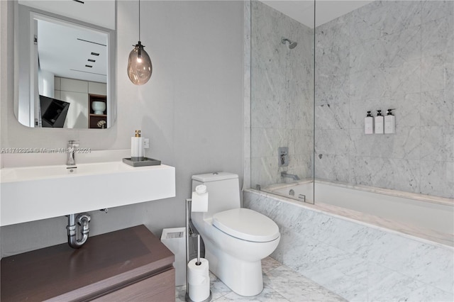 bathroom featuring toilet and tiled shower / bath