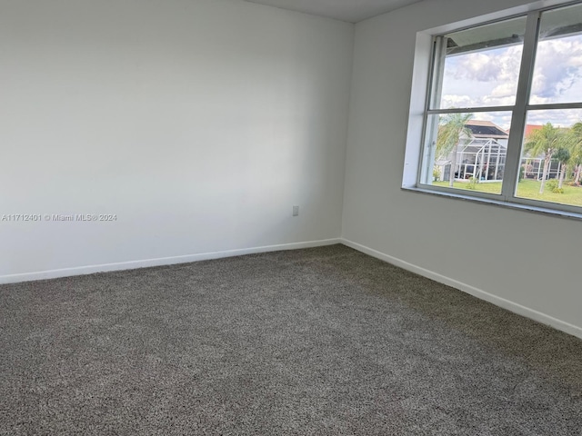 unfurnished room featuring carpet flooring