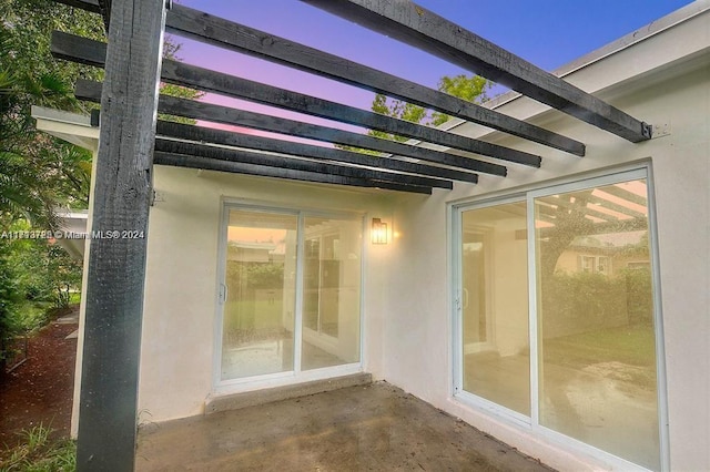 view of patio terrace at dusk