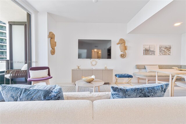 601 NE 1st Ave Unit 2409, Miami, FL 33132 - living room with baseboards and wood finished floors