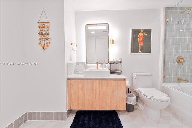 full bathroom featuring vanity, toilet, and tiled shower / bath