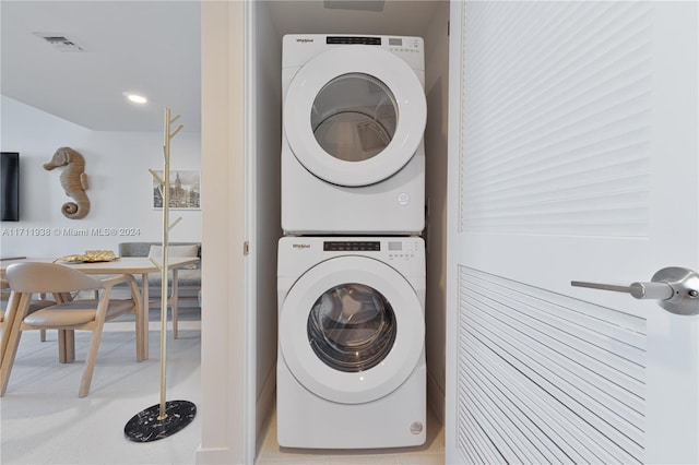 washroom with stacked washer / drying machine