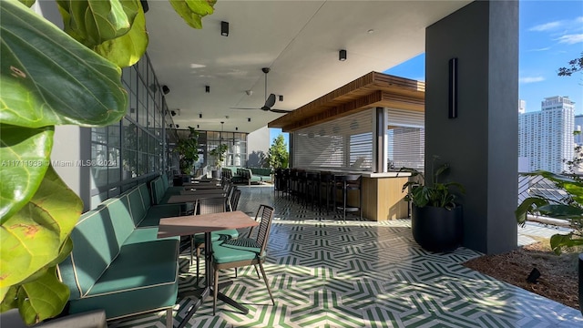 view of patio / terrace featuring ceiling fan