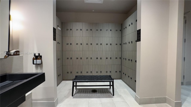 interior space with tile patterned floors and a shower