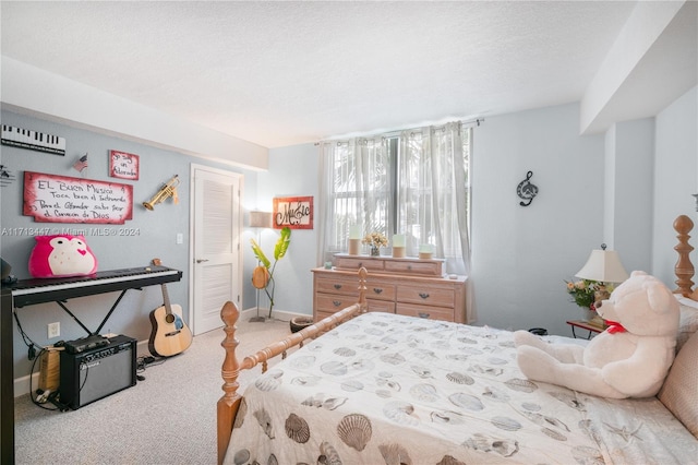 carpeted bedroom with a textured ceiling and a closet