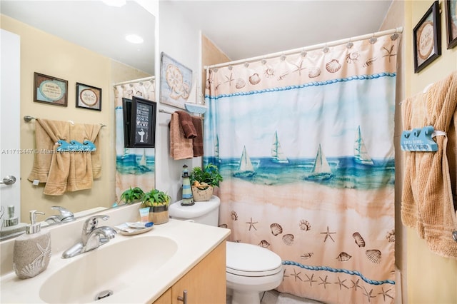 bathroom featuring a shower with curtain, vanity, and toilet