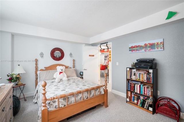 bedroom featuring light colored carpet