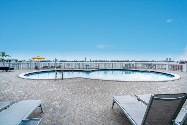 view of swimming pool with a patio