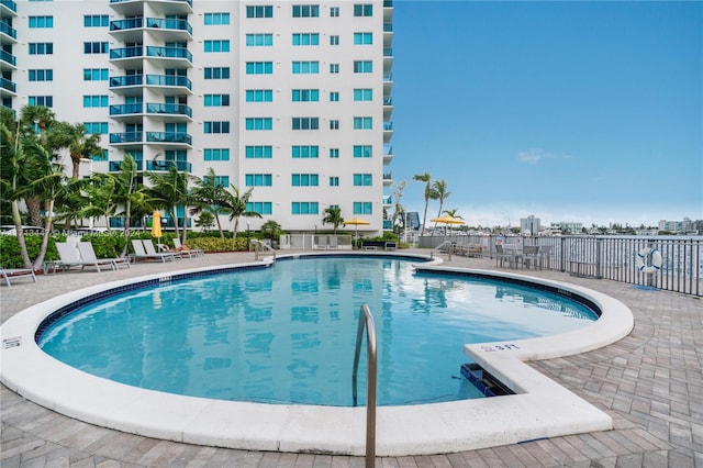 view of swimming pool featuring a patio area