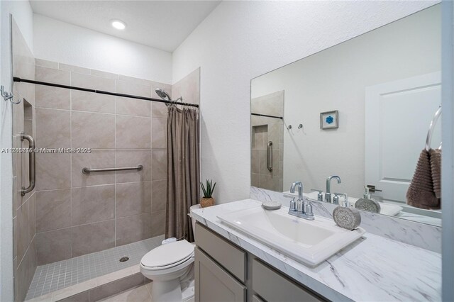 495 NE 5th Ln, Florida City, FL 33034 - bathroom featuring a stall shower, vanity, and toilet