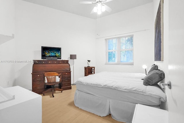 bedroom with light wood-type flooring and ceiling fan