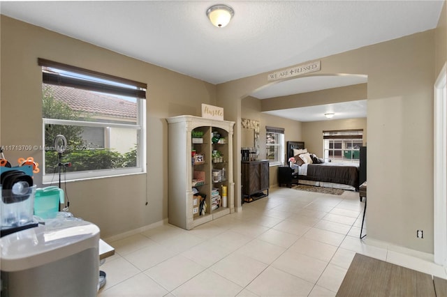 bedroom featuring light tile patterned floors