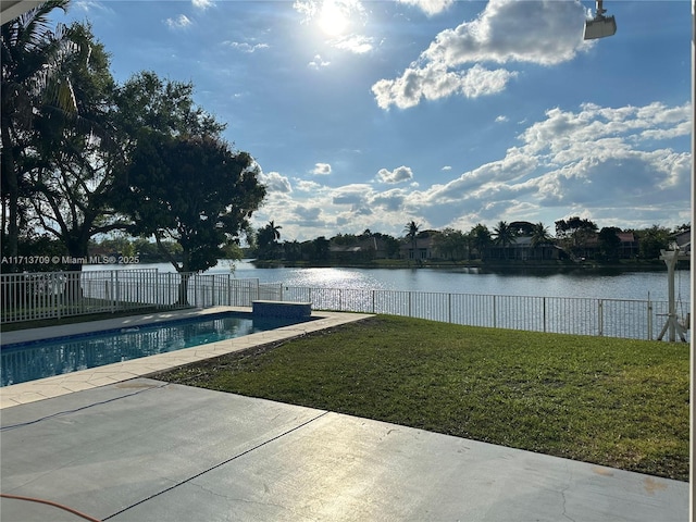 view of pool featuring a fenced in pool, a water view, a fenced backyard, a yard, and a patio