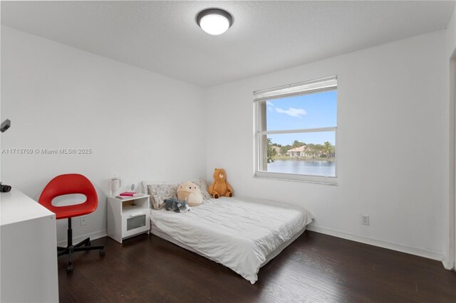 unfurnished room featuring dark hardwood / wood-style flooring