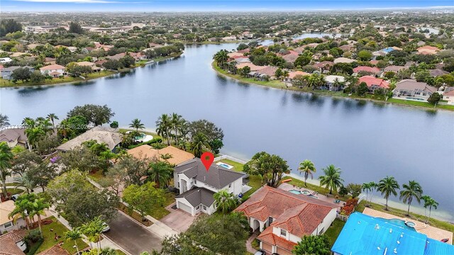 view of home's community featuring a yard and a water view