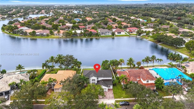 aerial view with a residential view and a water view