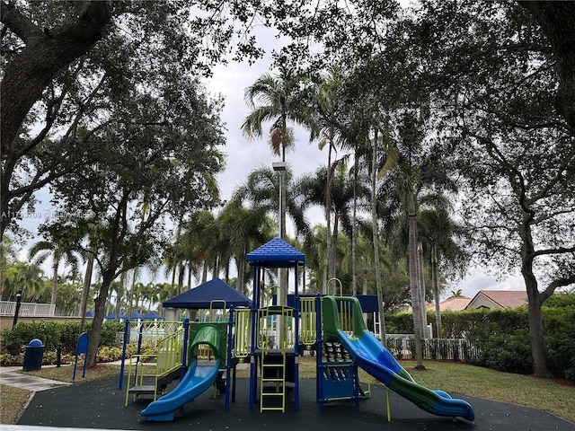 communal playground featuring fence