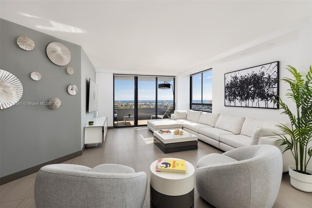 living room featuring floor to ceiling windows