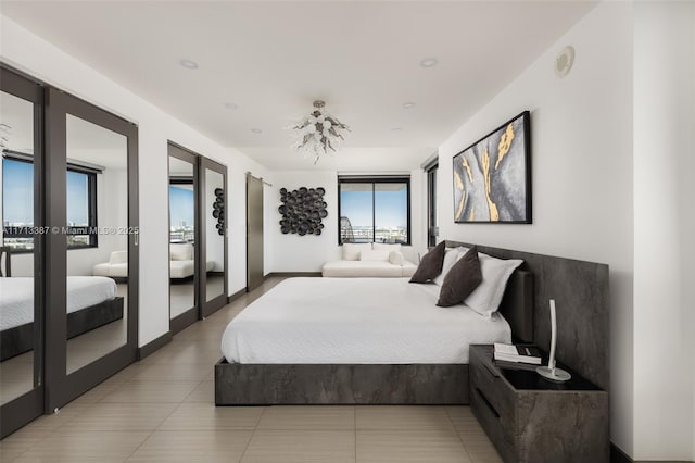 bedroom with french doors and tile patterned floors