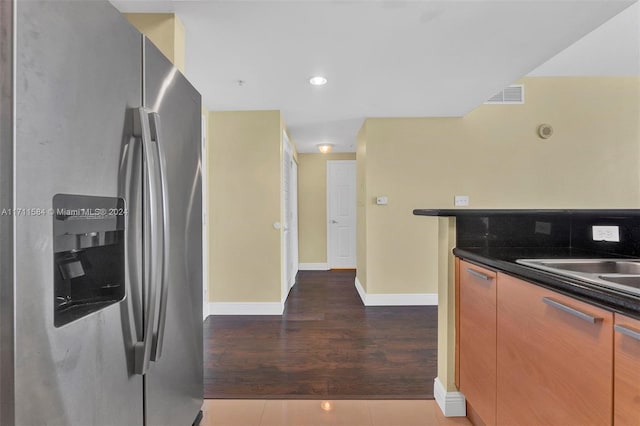 kitchen featuring tile patterned floors and stainless steel fridge with ice dispenser