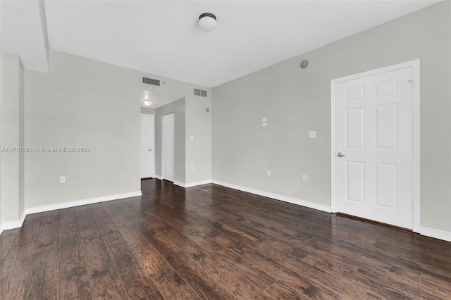 spare room featuring dark hardwood / wood-style floors