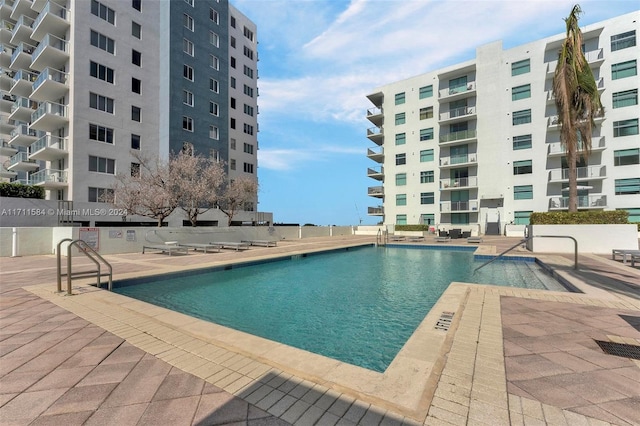 view of swimming pool featuring a patio area