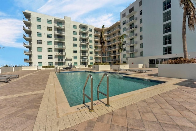 view of pool featuring a patio