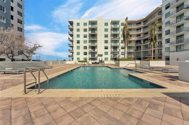 view of swimming pool with a patio