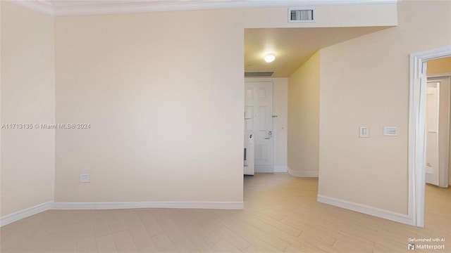 empty room featuring ornamental molding