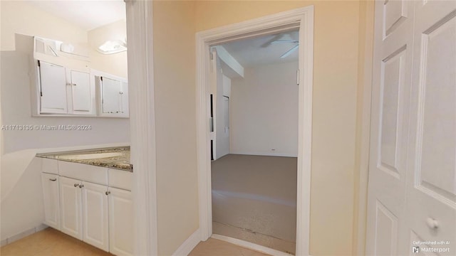 bathroom with tile patterned floors and vanity