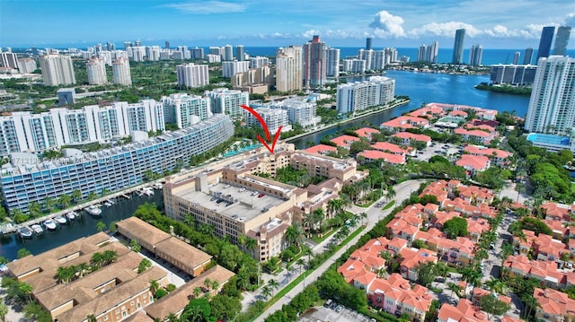 birds eye view of property featuring a water view