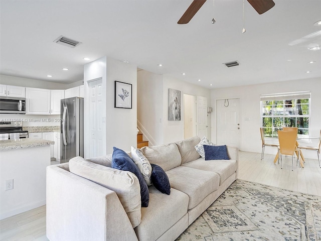 living room featuring ceiling fan