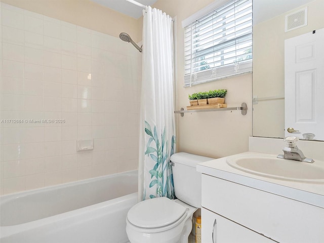 bathroom with shower / bath combination with curtain, vanity, visible vents, and toilet